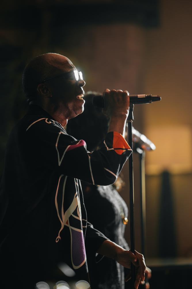 A singer performing live at Fuoco
