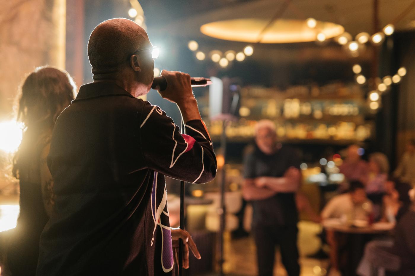 The singer performing to guests in the dining room